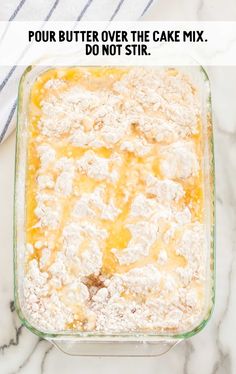 a casserole in a glass dish with the words pour butter over the cake mix, do not stir