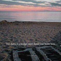 there is a blanket on the beach with a quote about being brave in this world