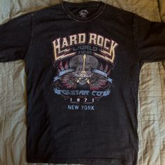 Hard Rock Cafe Band T-Shirt X-Small But Oversized I Normally Wear A Medium And This Fits Me Great Condition Never Worn Black Cotton T-Shirt Distressed Rock T-shirt For Streetwear, Distressed Rock Style T-shirt For Streetwear, Rock Style Distressed T-shirt For Streetwear, Black Distressed Rocker Tops, Distressed Rock T-shirt For Concerts, Rocker Distressed T-shirt For Concert, Rock Style Logo Print Tops For Concert, Rock Style T-shirt With Logo For Concerts, Distressed Black T-shirt For Concerts