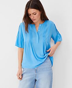 Elevate your wardrobe with the Ann Taylor Mixed Media Pintucked Blouse, a masterpiece of texture and style. This cerulean blue blouse for women combines elegance and comfort, making it a versatile addition to any outfit.

- Size: XS
- Color: Cerulean Blue
- Material: Front, sleeves, back yoke: 100% Polyester; Knit back: 95% Polyester, 5% Spandex
- Fit: Relaxed fit
- Length: 25 inches long
- Features: Crew neck, short sleeves, hidden button front, pintuck detailing
- Care Instructions: Machine wa Summer Workwear Tops With Pintucks, Chic Blue Tops With Pleated Sleeves, Casual Pintuck Blouse For Work, Blue Pleated Sleeve Tops For Work, Hip Style, Style Steal, Cerulean Blue, Blazer And Skirt, Blouse For Women