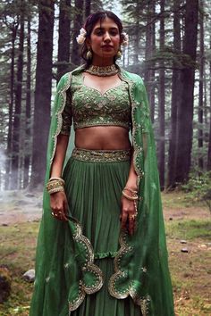 Fern green layered lehenga with embroidery on the waist. Comes with embroidered blouse and dupatta.
Component: 3
Pattern: Embroidery
Type Of Work: Mirror, Sequin and Cutdana
Neckline: Leaf
Sleeve Type: Half
Fabric: Crepe and Tissue
Color: Green
Other Details: 
Padded blouse
Dupatta with embroidered scallop border
Closure: Back zip
Occasion: Sangeet - Aza Fashions Green Lehenga With Intricate Embroidery For Festive Occasions, Festive Green Lehenga With Intricate Embroidery, Anarkali Green Lehenga With Intricate Embroidery, Green Saree Set With Intricate Embroidery, Bollywood Green Lehenga With Intricate Embroidery, Green Sharara With Intricate Embroidery For Reception, Green Lehenga With Traditional Drape For Festive Season, Festive Green Sharara With Intricate Embroidery, Festive Green Choli With Intricate Embroidery