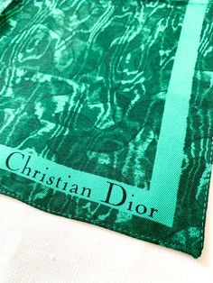 Malachite marble faux bois silk pocket square scarf. Great on a bag to add a pop of color. We also love wearing these at the neck or on the wrist mingled with your bracelet stacks. Christian Dior Poison perfume advertising scarf. 13" x 12.5" Luxury Square Silk Scarf For Gift, Trendy Green Silk Scarf Gift, Chic Green Silk Scarf Gift, Chic Green Silk Scarf For Gift, Dior Poison Perfume, Perfume Advertising, Christian Dior Poison, Poison Perfume, Bracelet Stacks