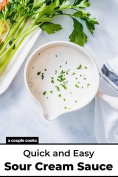 a white bowl filled with sour cream sauce next to celery