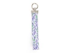 Introducing the Lavender Blooms Wristlet Keychain from the Lavender Garden Paw-ty Collection. This delightful accessory effortlessly matches your fur baby's bandana and coordinates with their collar and leash. Keep your keys secure and stylish with its spring-loaded design. The redesigned keychain is scratch-resistant, ensuring a fresh and new appearance. Each keychain is engraved with a heart and paw print, serving as a constant reminder of your precious furbaby. With a charming lavender plant Purple Rectangular Wristlet For Gift, Rectangular Purple Wristlet As Gift, Heart Paw Print, Lavender Garden, Bandana Baby, Lavender Plant, Plant Pattern, Wristlet Keychain, Pet Parent