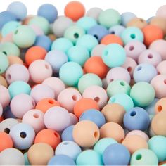 many different colored beads with holes in them