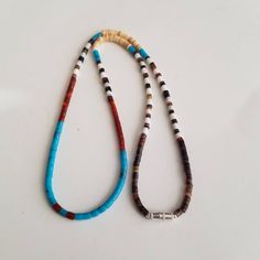 This gorgeous hand-strung with mix heishi bead, seashell necklace will look amazing with a Southwestern style. Length: 18 inches Free shipping Necklace is hand- strung by me. Thank you for looking! https://www.etsy.com/shop/lovelyturquoise Southwestern Style Heishi Beads Jewelry For Beach, Southwestern Turquoise Beaded Necklaces For Beach, Turquoise Southwestern Beaded Necklace For Beach, Southwestern Turquoise Necklace For Beach, Southwestern Style Necklaces With Natural Stones For Beach, Adjustable Artisan Turquoise Heishi Beads Necklace, Adjustable Artisan Turquoise Necklace With Heishi Beads, Bohemian Single Strand Heishi Beads Necklace, Handmade Southwestern Beaded Necklaces For Beach