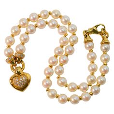 The marriage of classic elements creates versatility for this lovely pearl diamond heart charm pendant necklace. Perfect for special occasion outfits paired with your favorite earrings or great for a flirty glam look with a crisp white collar shirt and your best jeans. The featured diamond heart puff charm and accompanying findings in eighteen karat yellow gold are accented eith over .50 carat total weight of faceted round diamonds. At a sixteen inch length this elegant necklace lies beautifully Glam Look, Special Occasion Outfits, Charm Pendant Necklace, Pearl Pendant Necklace, Akoya Pearls, Pearl Diamond, Elegant Necklaces, Gold Charm, Diamond Heart