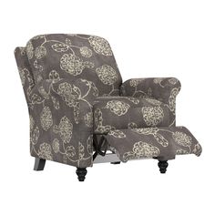 a chair that is upholstered with a flower pattern on the back and arms