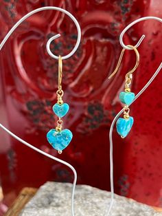 "This is a pair of beautiful dangle earrings! They are mad with genuine Kingman turquoise. They are made with turquoise hearts 6mm to 19mm. Finished with gold plated fish hook earwires. They measure 1 1/2\" from the top of the hook." Turquoise Dangle Earrings With Heart Beads, Turquoise Heart Beads Dangle Earrings, Hypoallergenic Turquoise Heart Jewelry, Hypoallergenic Heart-shaped Turquoise Jewelry, Turquoise Heart Drop Earrings As Gift, Jellyfish Necklace, Teal Bracelet, Valentine Earrings, Valentines Earrings