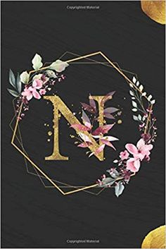 the letter n is surrounded by flowers and leaves on a black background with gold foil