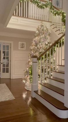 the stairs are decorated with christmas lights and garland