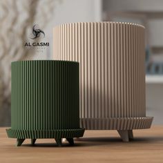 two green and beige vases sitting on top of a wooden table next to each other