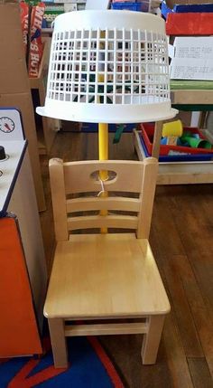 a child's chair with a lamp on top of it in a toy store