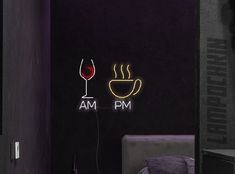 there is a neon sign that says am pm and a glass of wine on the wall