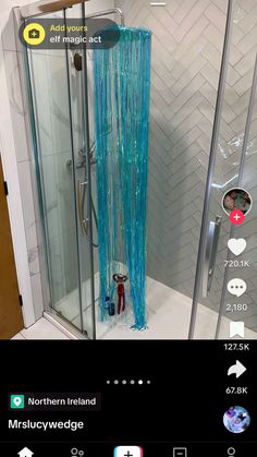 an image of a shower with blue streamers on the walls and in the corner