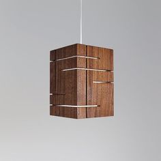 a wooden light fixture hanging from a ceiling