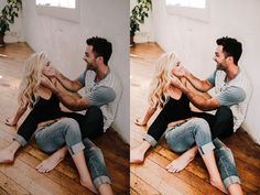 a man and woman sitting on the floor in front of a white wall hugging each other