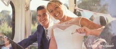 the bride and groom are posing for a photo on the trolley car ride at their wedding