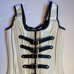 Women’s Leather Gothic Bustier Corset. This Corset Is Made Of High Quality 100% Genuine Real Sheep Leather. It Features A Zip Front Closure With 6 Buckle Accent Closures, And Four O-Rings (Two In The Front And Two In The Back) For A More Mistress Look And Bodycon Silhouette. Inside: Lining Is 100% Cotton Jean Material With 12 Flat Corset Bones. Back Design: Full Back Lace Closure With 24-Silver, Rust Free Eyelets For Tightening And Waist Shaping. The Corset Includes A 12 1/2 X 6 1/4 Panel Or Lace Guard To Provide Comfort For Tight Lacing Or You May Show Your Skin By Not Adding The Lace Guard. Chic White Formal Corset, Leather Bustier Corset, Corset Boning, Leather Bustier, Jean Material, Lace Tights, Amy Lee, Chic Leather, Handmade Clothing