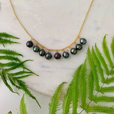 "Cute and Dainty Tahitian Pearl Dangling Charm Necklace . Super cute to wear on it's own or to layer with your other favorite jewelry pieces ! ✨This necklace is delicate and simple . ✨Pearls: Size : approx 8-9mm Surface :Overall good surface quality, have a few minor imperfections but overall smooth and clean surface . Color : As seen in pictures. The colors will be similar as pictured with some variations . Luster : Good Shape : circled / drop ✨Metal : You can choose either sterling silver or 1 Tahitian Pearl Drop Necklace As Gift, Tahitian Pearl Drop Necklace For Gift, Handmade Tahitian Pearl Necklace Gift, Tahitian Pearl Drop Necklace With Round Beads, Tahitian Pearl Briolette Necklace For Gifts, Handmade Akoya Pearl Necklace Gift, Tahitian Pearl Pendant Necklace With Pearl Charm, Tahitian Pearl Drop Pendant Necklace, Tahitian Pearl Pendant Necklace As Gift