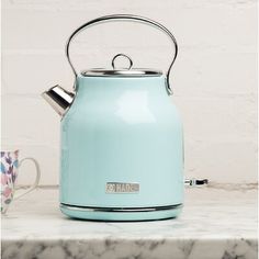 a tea kettle sitting on top of a counter