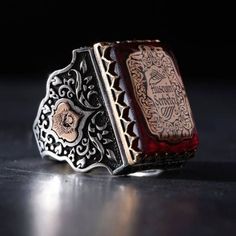 Rectangle red stone name men's ring Our product is 925 sterling silver and the upper part is red. Personalized names and designs are engraved on amber. On the sides, the Ottoman ensign and the Ottoman Tugra are embroidered. Custom lettering on top and sides logo name design can be done. Rectangle Name Red Amber Silver Men's Ring, Handmade Adjustable Ring, Turkish Handcrafted Ring, 925 Sterling Silver **PRODUCT DESCRIPTIONS**     Sent from a small business in TURKEY.    * Materials: 925k Sterling Collectible Red Engraved Ring, Antique Red Rectangular Rings, Red Carved Rings For Gifts, Red Carved Ring For Gift, Antique Red Engraved Ring, Luxury Engraved Ruby Ring As Gift, Luxury Engraved Ruby Ring Gift, Red Engraved Ring For Formal, Red Engraved Ring For Formal Occasions