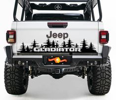 jeep gladiator decal on the back of a white truck with pine trees