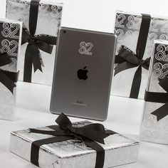 an ipad sitting on top of a gift box