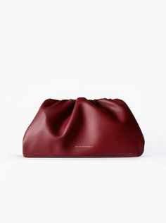 A classic day-to-night favorite from FREYA ESTEPHAN. Clutch * Outer and inner lining made of 100% leather * Mini: 22 cm wide x 5.5 cm deep x 13 cm high * Medium: 30 cm wide x 7 cm deep x 15 cm high  * Magnetic frame closure. Gold finish * Loops for optional shoulder strap or chain   NEW, with tags and box. Color: Dark red Red Business Bag With Smooth Grain, Classic Red Bags For Fall, Burgundy Evening Shoulder Bag With Leather Lining, Burgundy Leather Bag For Fall, Evening Burgundy Shoulder Bag With Leather Lining, Burgundy Leather Pouch Shoulder Bag, Burgundy Soft Leather Evening Shoulder Bag, Burgundy Leather Evening Bag, Classic Burgundy Shoulder Bag For Fall