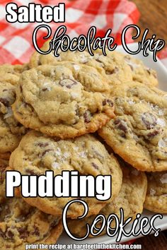 salted chocolate chip pudding cookies are piled on top of each other in a white bowl