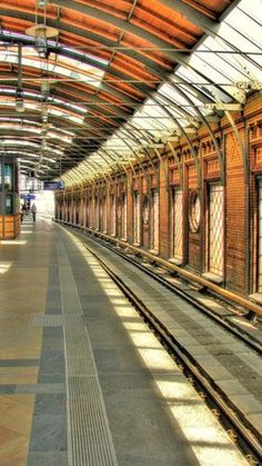 an empty train station with no people on the platform