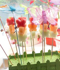 there are many pops that have been made to look like toothpicks with fairy decorations on them