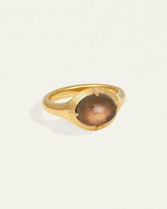 The Esse Ring is an 18k gold vermeil seal ring with oval cabochon dome. Shop signet ring with smoky quartz symbolising connection to the earth. Timeless Signet Ring With Oval Cabochon Gemstone, Timeless Gold Polished Moonstone Ring, Timeless Gold Moonstone Ring With Polished Finish, Modern Gold Signet Ring With Cabochon, Timeless Gold Dome Ring With Gemstone, Gold Oval Dome Ring With Gemstone, Gold Dome Ring With Polished Oval Cabochon, Gold Dome Ring With Polished Finish And Oval Cabochon, Classic Gold Moonstone Cabochon Ring