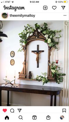 an instagram page with a cross and flowers on the wall next to a table