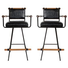 a pair of black leather and metal barstools with wooden arms, on white background