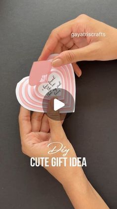 two hands holding cards with the words cute gift idea