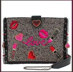 "Mary Frances Kiss & Tell Crossbody Clutch Handbag NEW WITH TAGS They say don't kiss and tell, but you won't be able to keep it to yourself with this dazzling crossbody handbag. With lively hand-laid beads of pink, red, gold, and silver colors, this bag is sure to catch some attention. Features a removable chain strap with hearts and a padded shoulder, this bag will be your match made in heaven. Dimensions: 9.75 x 0.75 x 7 FEATURES Removable crossbody chain strap with genuine leather padded-shou Mary Frances Southwest Handbag, Mary Frances Purses, Kiss And Tell, Mary Frances Bags, Mary Frances Handbags, Beaded Crossbody Bag, Cell Phone Strap, Keep It To Yourself, Mary Frances