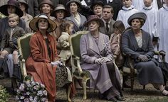 many people are sitting on chairs in front of each other and one woman is wearing a hat