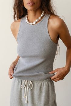 The Rib Tank is our go-to for any look, any season. It holds everything in and does not require a bra underneath. Crafted with our ultra-flattering and comfortable rib fabric, featuring a crewneck, racerback and fine rib texture. Set it up with — The Rib Kick Flare or The Pop Pant Made in LA Ribbed Crew Neck Tank Top For Layering, Solid Racerback Tank Top For Loungewear, Everyday Ribbed Athleisure Tops, Everyday Athleisure Ribbed Tops, Everyday Crew Neck Seamless Tank Top, Everyday Crew Neck Tank Top With Ribbed Neckline, Ribbed Crew Neck Tank Top For Everyday, Everyday Stretch Tank Top With Ribbed Neckline, Sporty Ribbed Tank Top For Layering