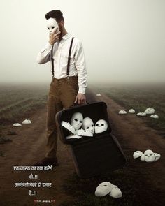 a man holding a suitcase while standing in the middle of a field with white faces on it