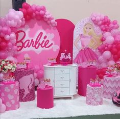 a barbie birthday party with pink decorations and balloons