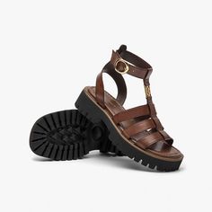 These gladiator sandals made from high-quality materials feature a unique brand buckle in the upper and solid color style. The wraparound ankle strap with an adjustable buckle offers a good fit for feet. Upper: 100% Cow Leather Lining: 100% Microfiber Insole: 100% Microfiber Outsole: 100% Rubber Foam Heel Height: 4.2 cm Weight: 1kg Dream Teacher, Jesus Sandals, Leather Strap Sandals, Fab Shoes, Ladies Sandals, High Heel Sneakers, Sandals Outfit, Sandal Shoes, Heel Design