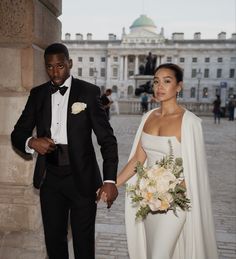 An elegant, minimal and scandi inspired intimate wedding. Bride wears a minimal floor length wedding gown with cape. Taken at somerset house in london 2021 City Hall Wedding Dress, Winter Wedding Dresses, Midi Wedding Dress, Somerset House, Civil Wedding Dresses, Wedding Court, Bridal Cape, Minimal Wedding, Courthouse Wedding