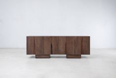 the sideboard is made out of wood and has three sections on each side, one with