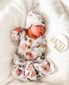 a baby laying on top of a bed next to a white blanket and pillow with the words lovely grey post