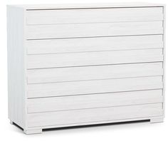 a white chest of drawers sitting on top of a wooden floor