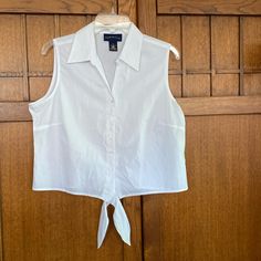 New Charter Club Sleeveless Top. White Cotton Button Up Top With Bottom Ties To Shorten And Show Tummy Or Meet At The Waist Of Your Pants. New And Perfect Condition Size 12 Or Large Armpit To Armpit Measures Approx 21” Length Of The Top Is Approx 20” - Not Tied Sleeveless Cotton Crop Top With Button Closure, Sleeveless Button Closure Crop Top, Casual Sleeveless Crop Top With Button Closure, Fitted Sleeveless Crop Top For Daywear, Sleeveless Cotton Crop Top With Buttons, Cropped Vest With Button Closure For Summer, Cropped Summer Vest With Buttons, Summer Cropped Vest With Buttons, Women Floral Blouse