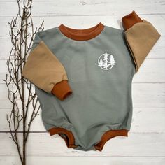 This sweet romper is made from a soft Organic cotton knit The fit is relaxed-there is a size chart to double check sizing Romper has a snap bottom Cotton Onesie For Playtime In Fall, Cute Brown Cotton Onesie, Green Cotton Bodysuit For Loungewear, Fall Cotton Bodysuit For Loungewear, Cotton Bodysuit For Fall Loungewear, Fall Cotton Loungewear Bodysuit, Fall Playwear Onesie, Casual Fall Bodysuit For Playtime, Casual Brown Cotton Bodysuit