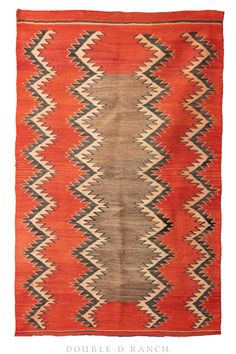 an orange and black navajo rug