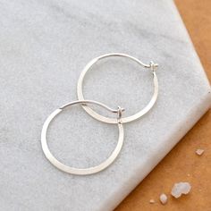 Simplicity Hoop Earrings - small round flat matte classic 14K Gold hoop earrings - Foamy Wader Minimalist Jewelry Earrings, 14k Gold Hoop Earrings, Hammered Hoop Earrings, Layering Necklaces, Whidbey Island, Sustainable Jewelry, Oxidized Silver, Gold Hoop Earrings, Gold Yellow